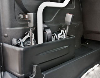 Restraints Storage Compartment